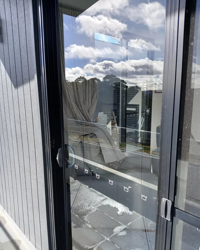 Sliding glass door after window cleaning, clear view to the garden