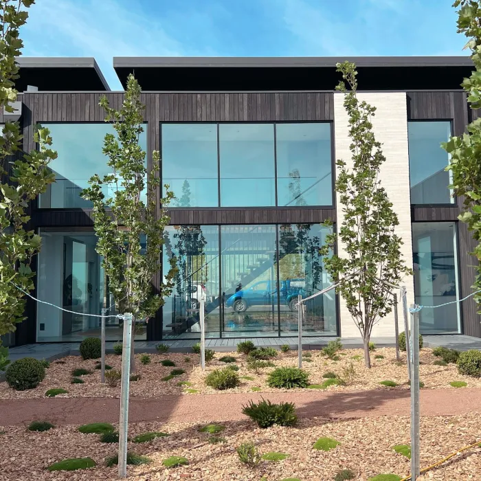 Two-storey glass-fronted home with sparkling windows